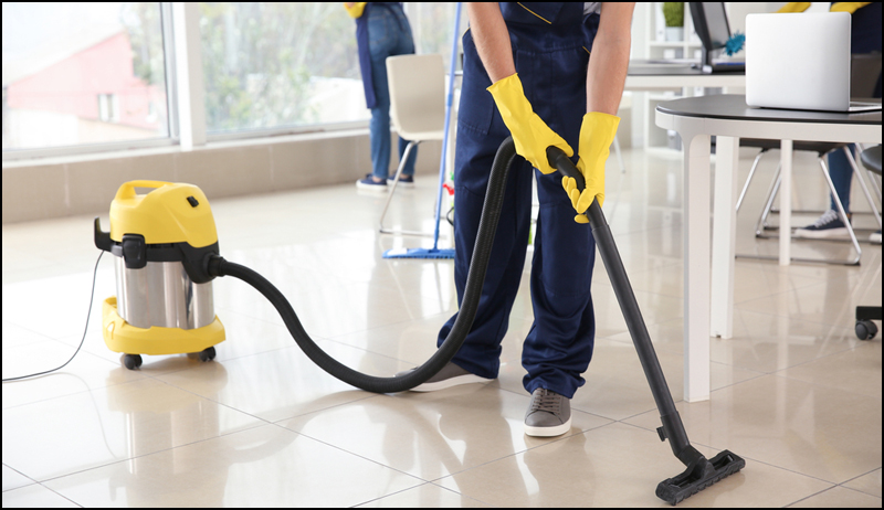 Janitor Vaccuming Office Floor